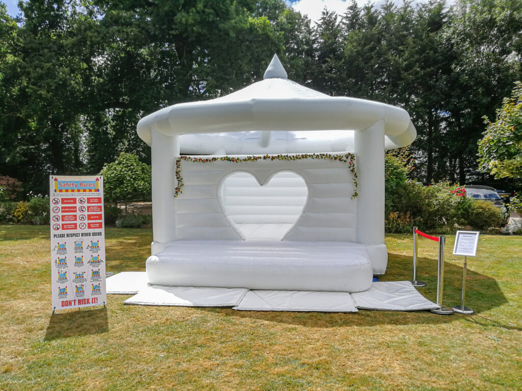 White bouncy castle set up for a wedding