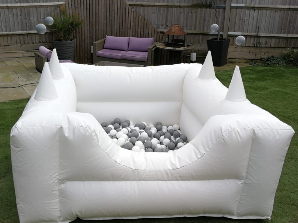 White ball pond filled with grey and white balls